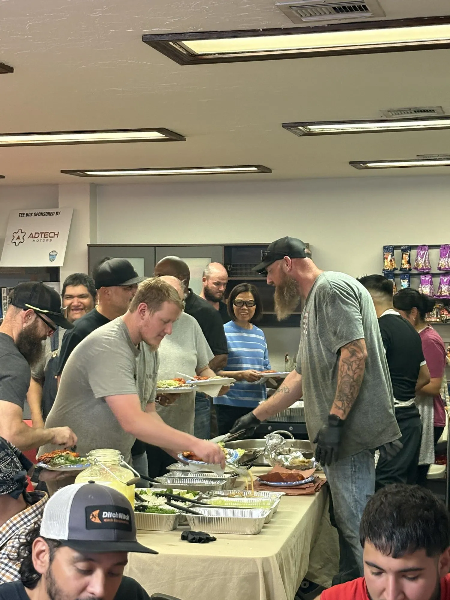 Chris from Adtech Motors serving the team breakfast at their first town hall.